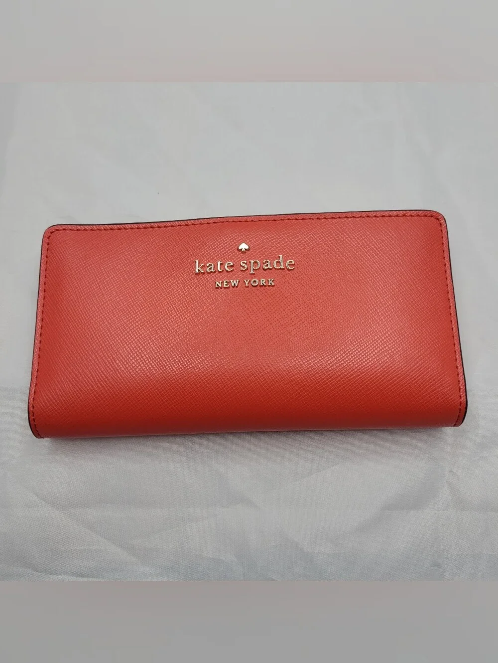 kate spade Coral Large Bifold Wallet with gold logo